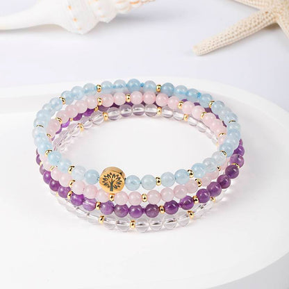 The Serene Sea and the Clear Light: Aquamarine, Rose Quartz, Amethyst, and White Quartz Four-level Serene Energy Spiral Ring